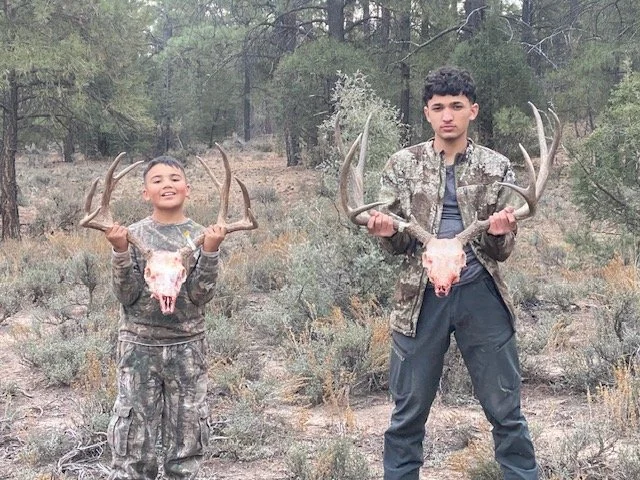 Hunter celebrating a successful guided hunt with Hook N 30 Outfitters