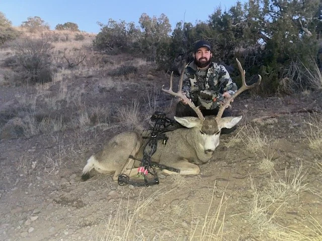 Hunter celebrating a successful guided hunt with Hook N 30 Outfitters