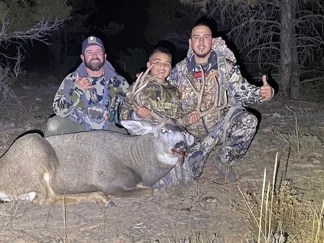 Hunter celebrating a successful guided hunt with Hook N 30 Outfitters
