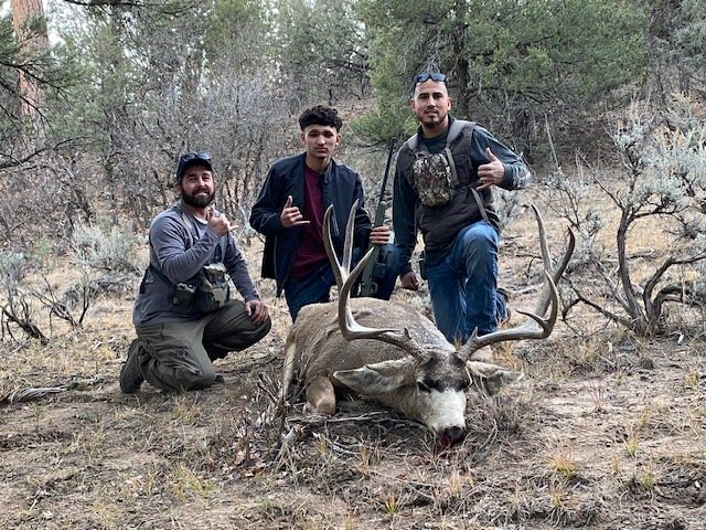 Hunter celebrating a successful guided hunt with Hook N 30 Outfitters
