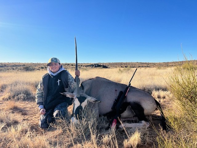 Hunter celebrating a successful guided hunt with Hook N 30 Outfitters