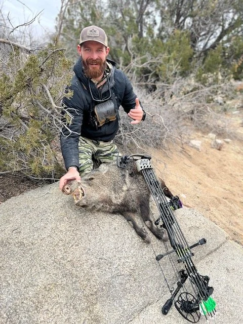 Hunter celebrating a successful guided hunt with Hook N 30 Outfitters