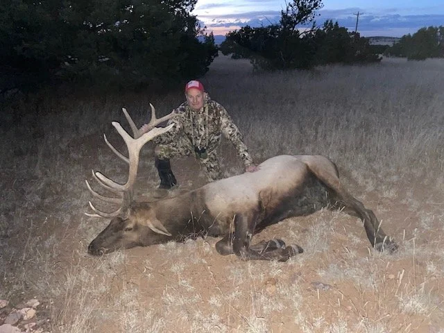 Hunter celebrating a successful guided hunt with Hook N 30 Outfitters