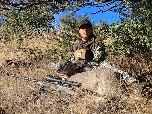 Hunter celebrating a successful guided hunt with Hook N 30 Outfitters