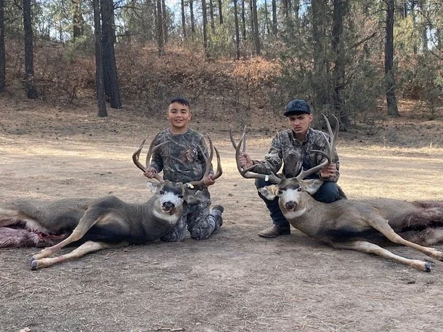 Hunter celebrating a successful guided hunt with Hook N 30 Outfitters