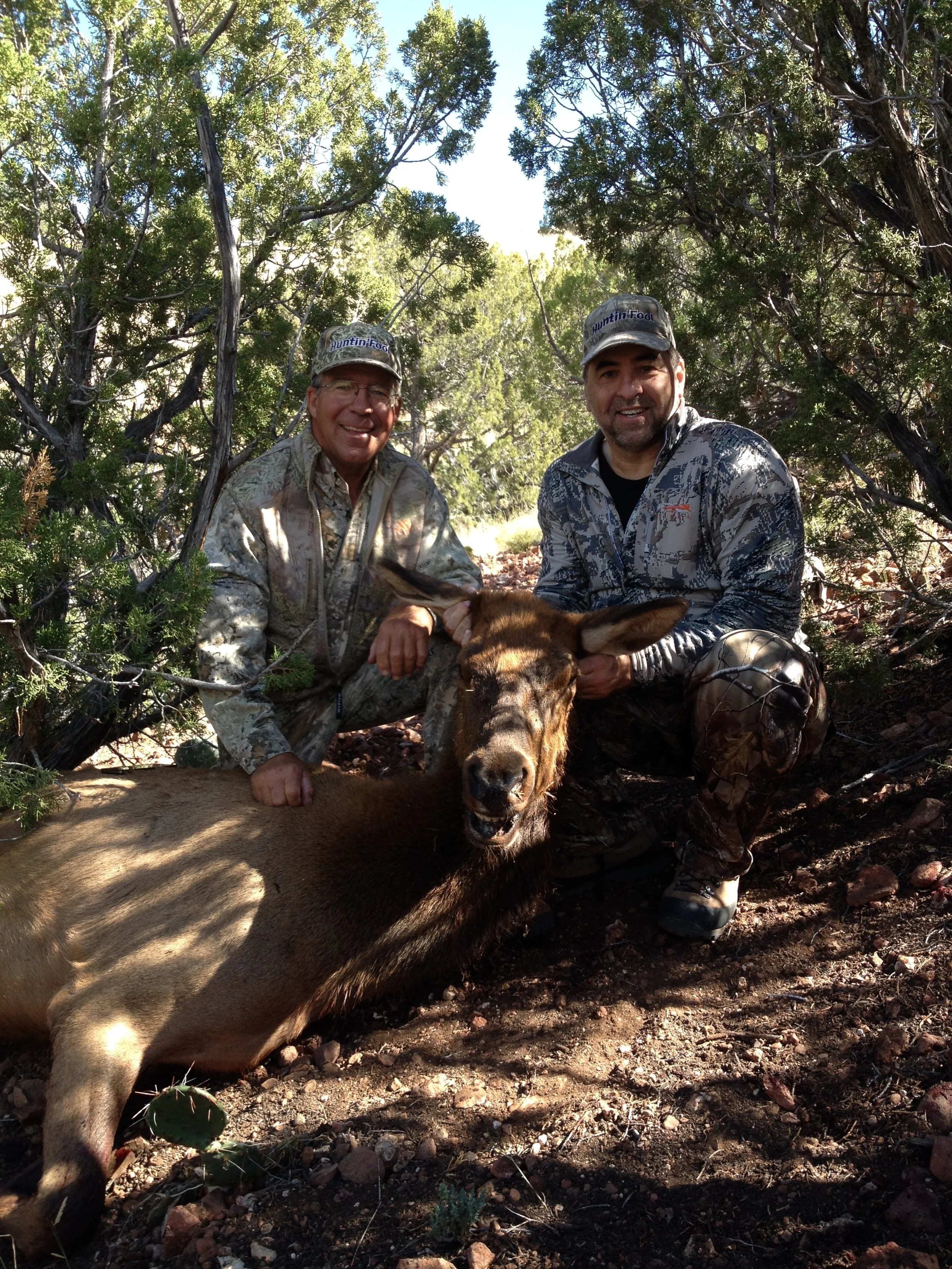 Hook N 30 Outfitters guide and hunter celebrating a successful elk hunt in the New Mexico wilderness.