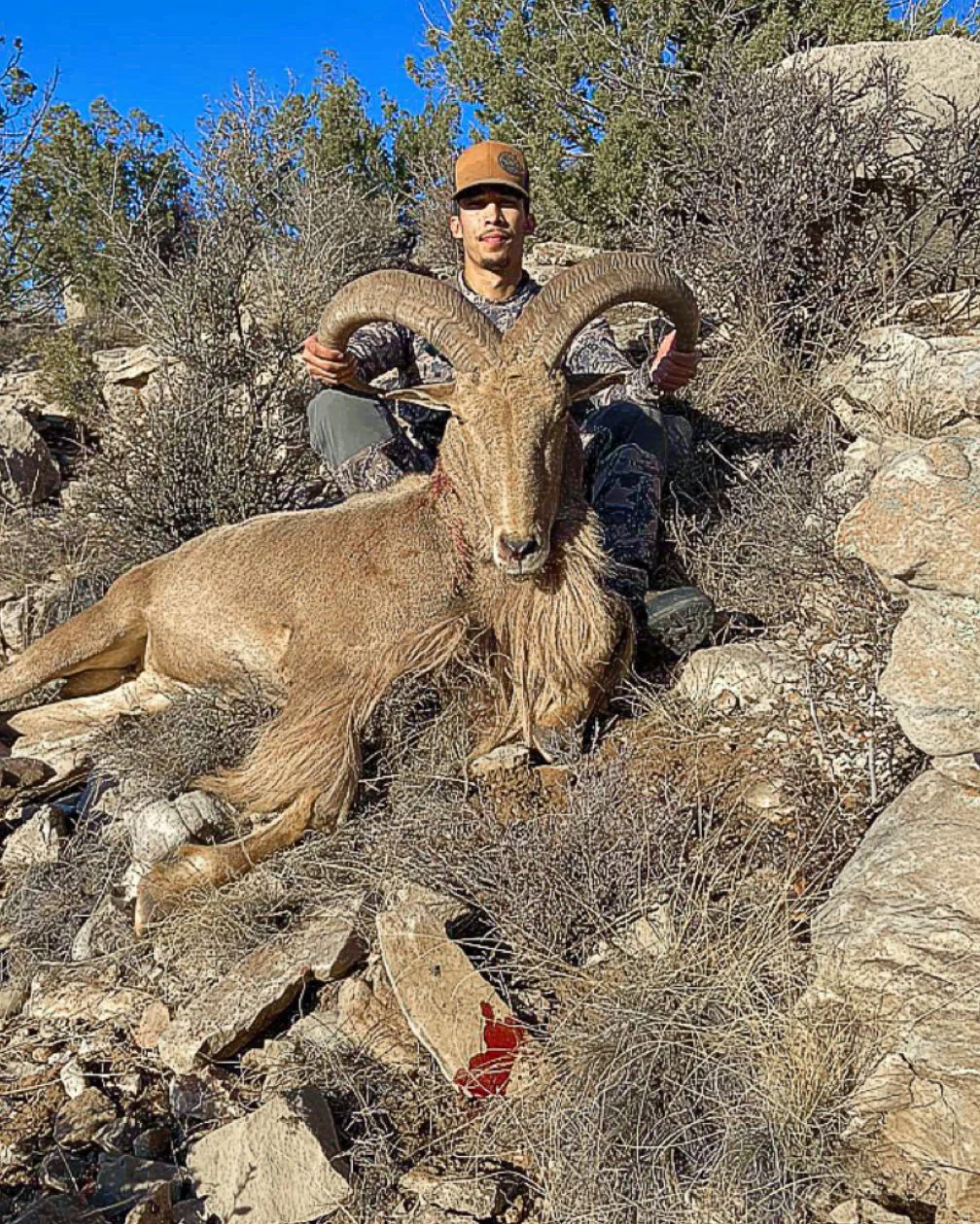 Hunter celebrating a successful guided hunt with Hook N 30 Outfitters