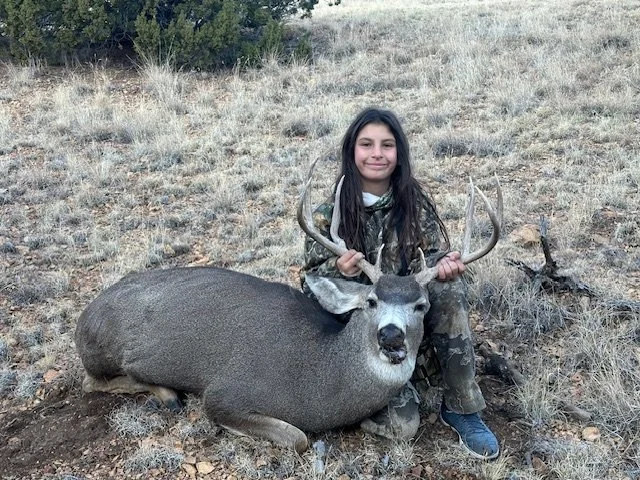 Hunter celebrating a successful guided hunt with Hook N 30 Outfitters
