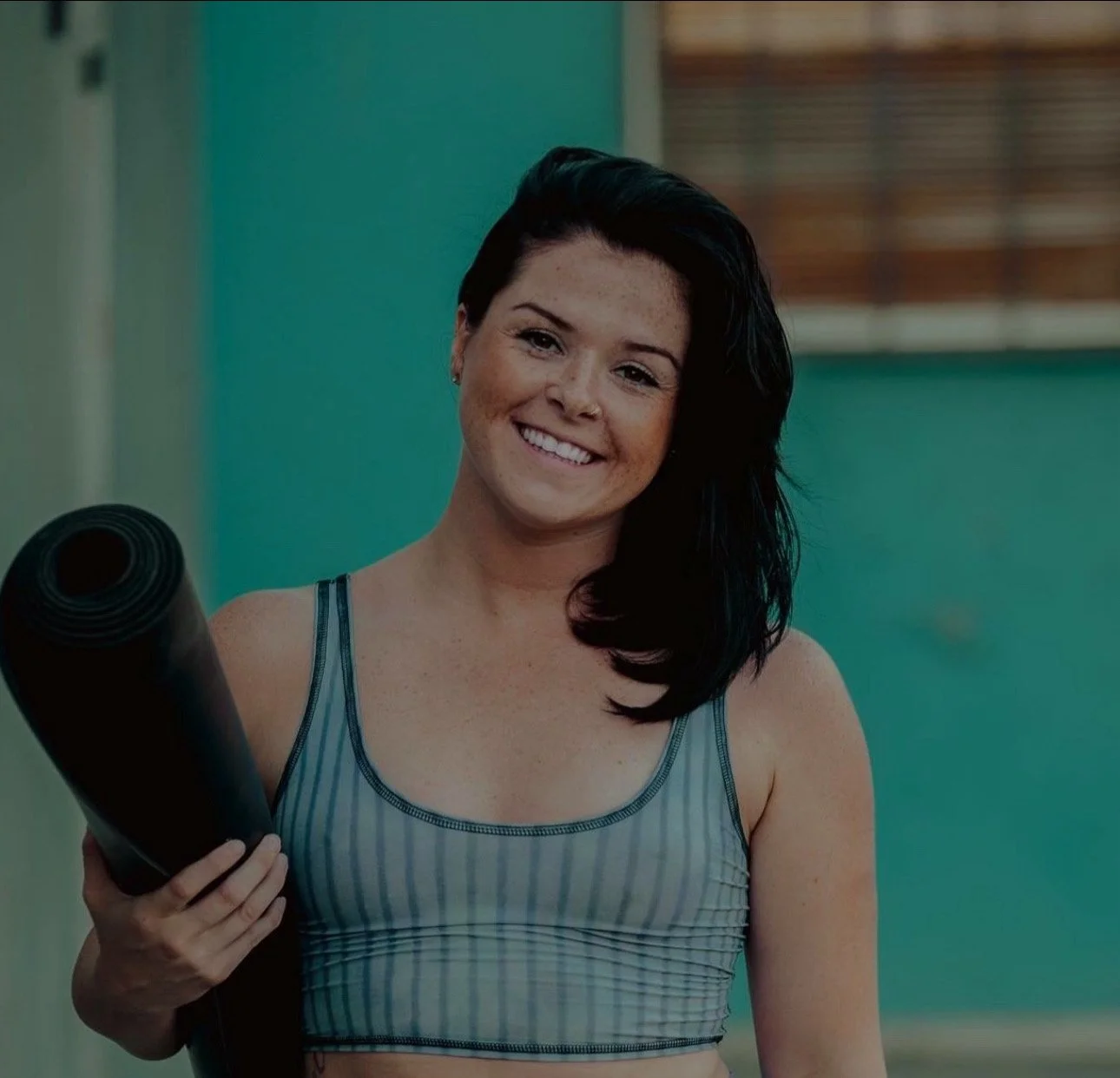 A promotional poster for Loveland Community Yoga featuring a mountain landscape with a white lotus flower and the text 'Move Breathe Connect'.