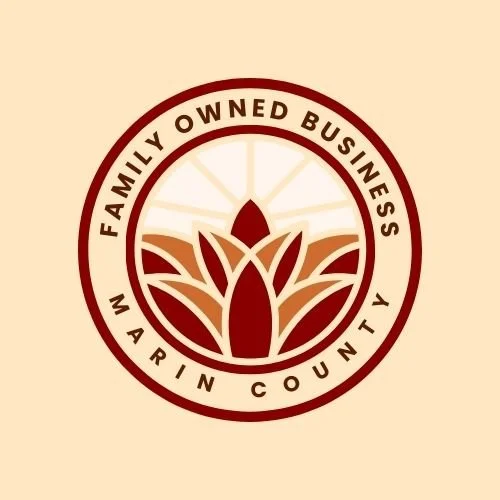 Logo for a family-owned business in Marin County featuring a stylized plant or flower within a circular border.