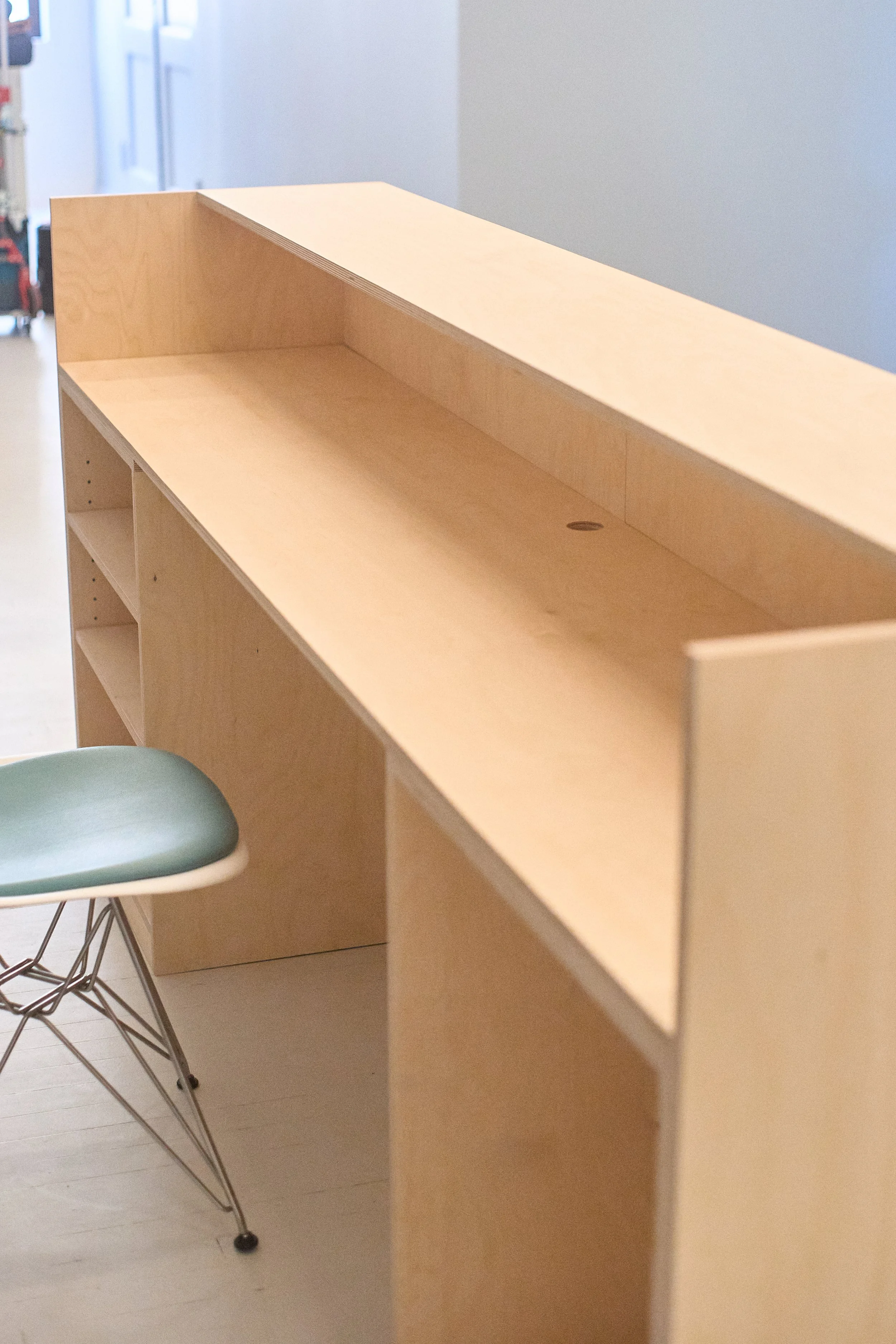 Reception desk overview showing functional layout and storage.