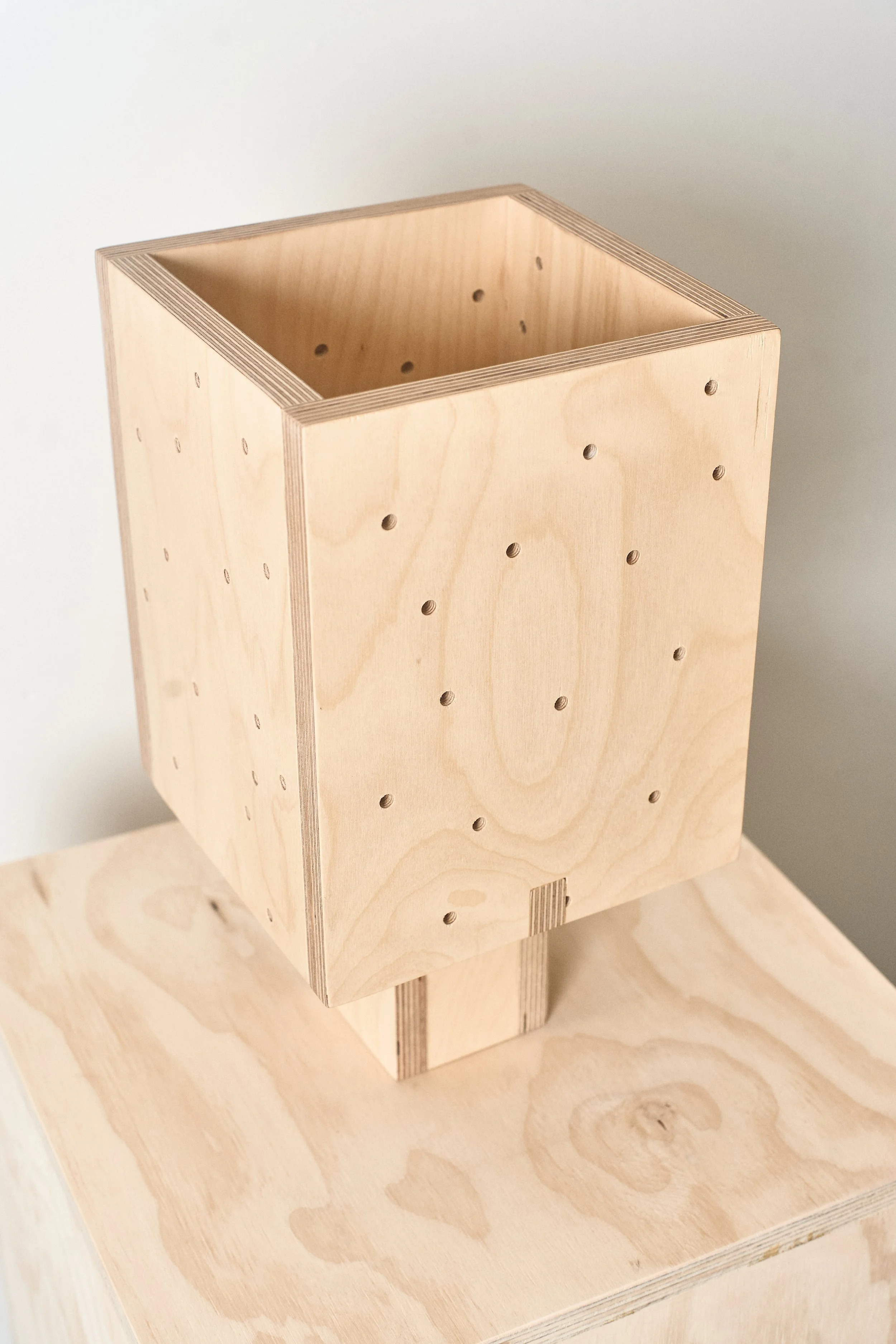 Side view of a handmade plywood table lamp by Derek Designs.
