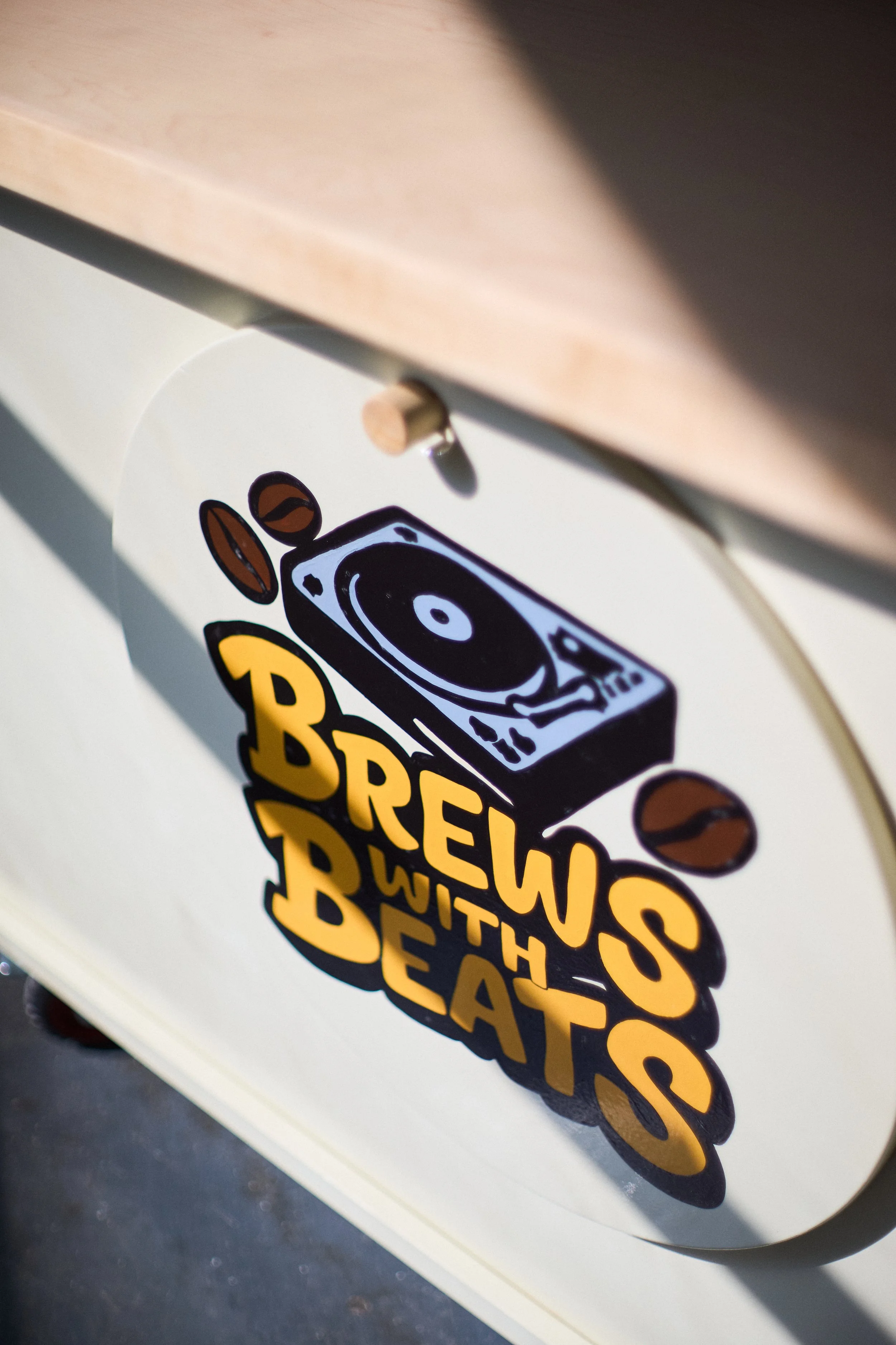 Detail of custom coffee cart graphics and wood fabrication by Derek Designs.