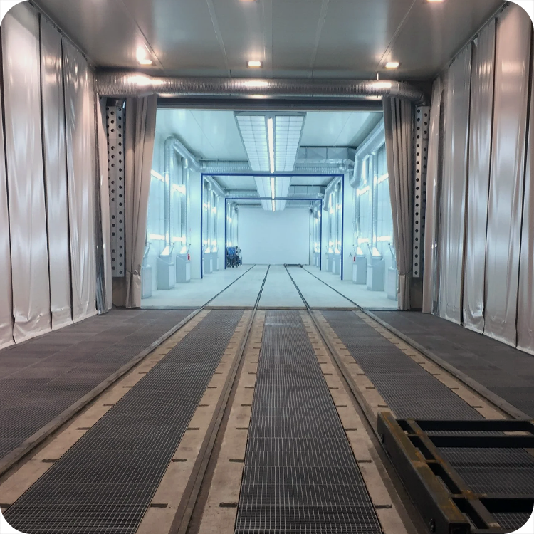 An automated A-200 blast cabinet with an Allen-Bradley HMI display screen and a robotic picking arm made by Fanuc