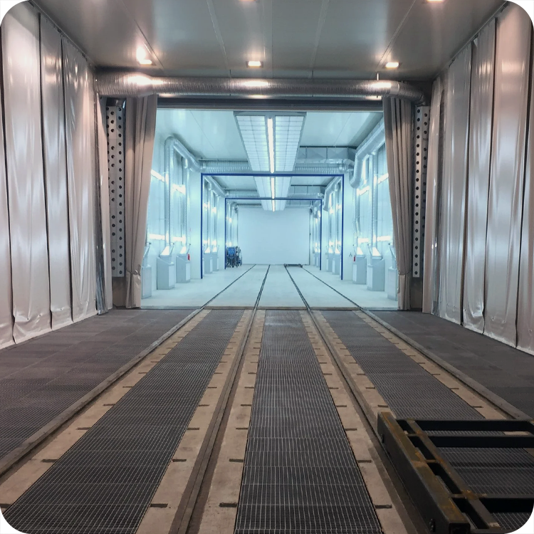 An automated A-200 blast cabinet with an Allen-Bradley HMI display screen and a robotic picking arm made by Fanuc