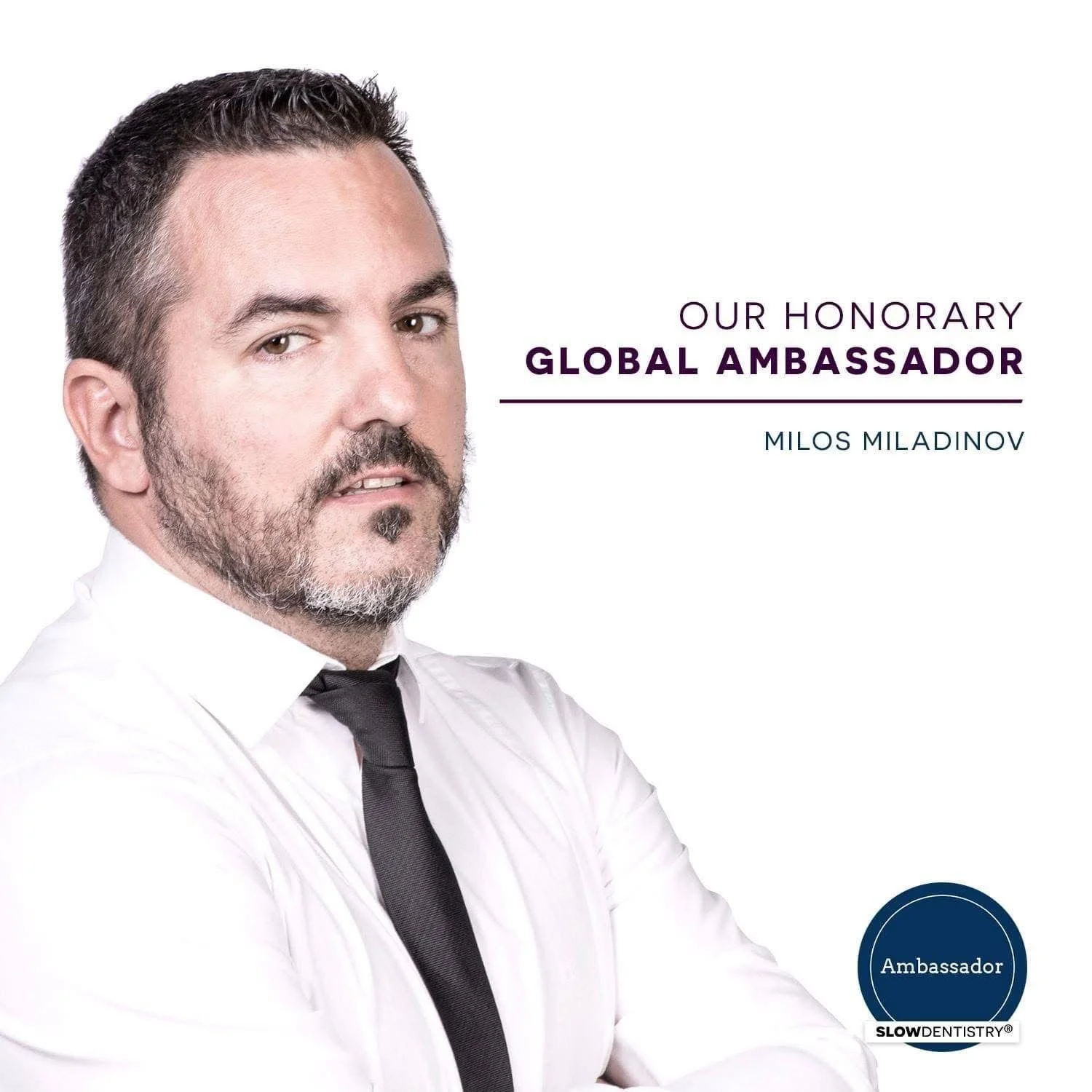 Photograph of Milos Miladinov in a white shirt and black tie, with text indicating he is an honorary global ambassador for Slow Dentistry.