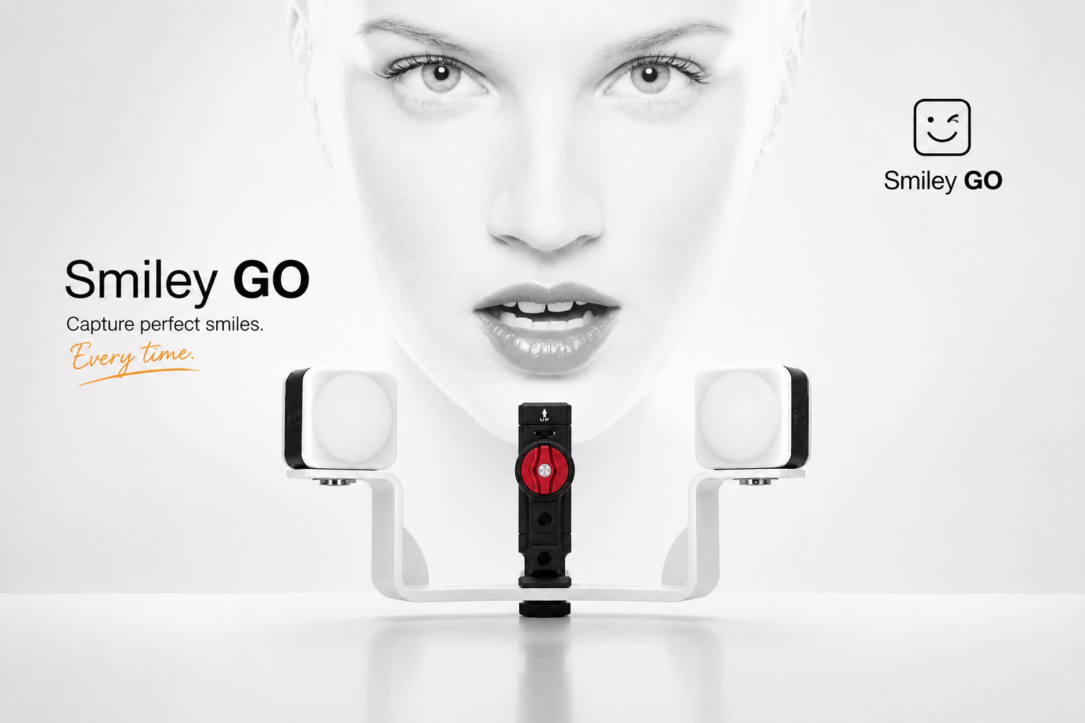 A promotional image for Smiley GO features a close-up of a woman with light skin and expressive eyes in the background. In the foreground, there is a device with two cameras on adjustable white arms and a central black component with a red dial. The text on the left reads "Smiley GO" with a slogan "Capture perfect smiles. Every time." The top right corner has a smiling face icon with the words "Smiley GO."