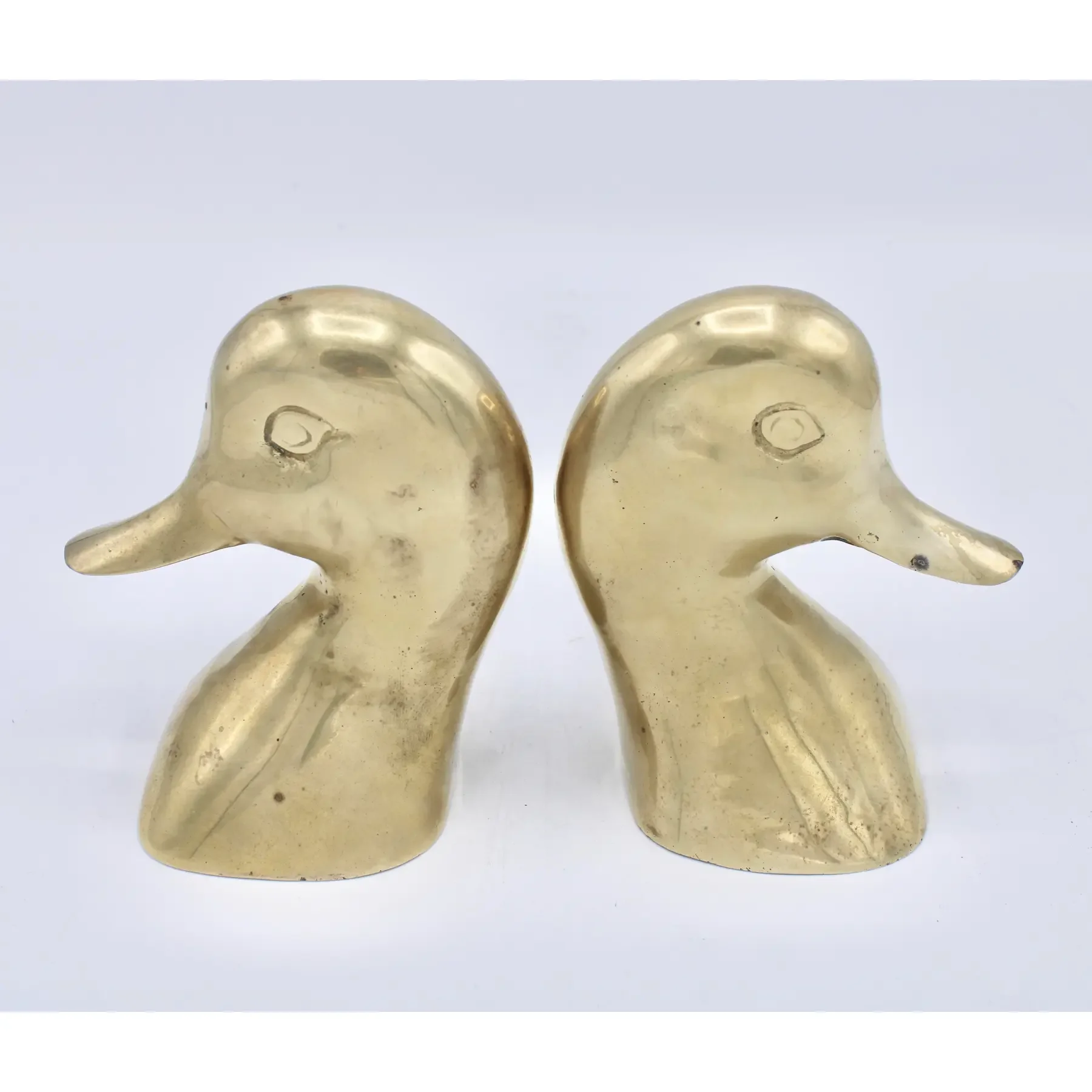 vintage-mid-century-modern-brass-duck-head-bookends-4584.webp