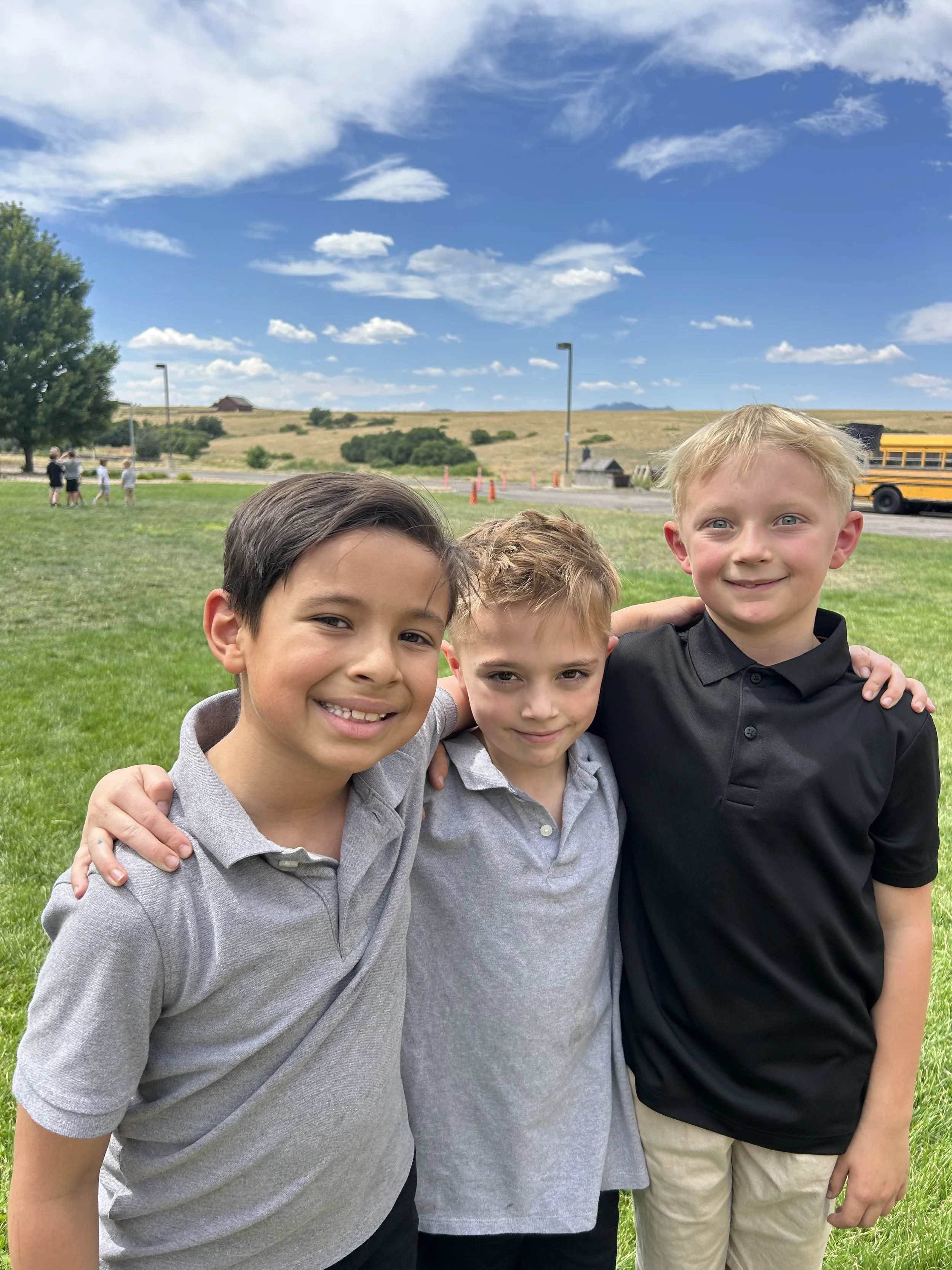 Three friends smiling at recess.jpg