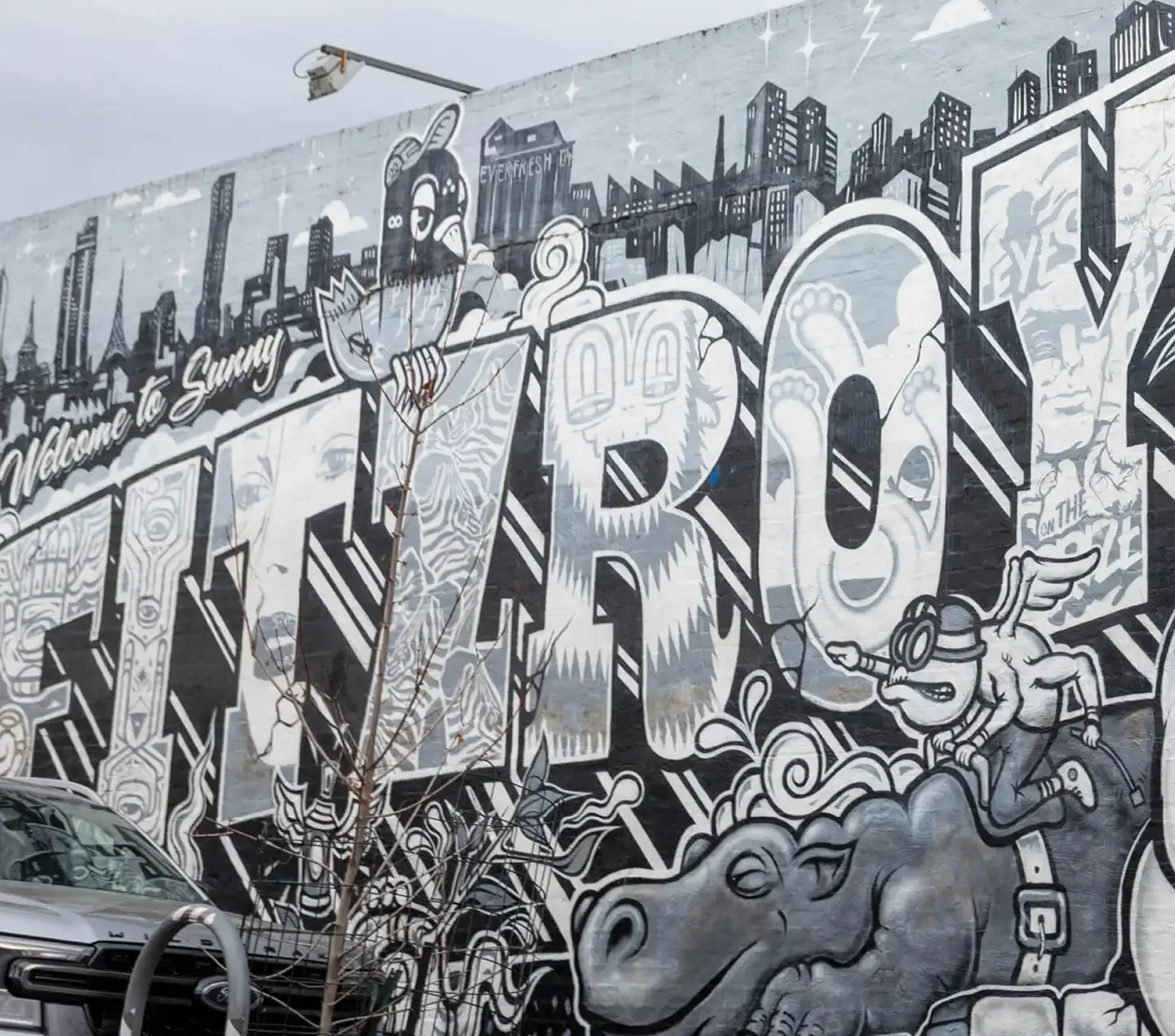 Black and white spray paint artwork on a wall which says 'Fitzroy'.