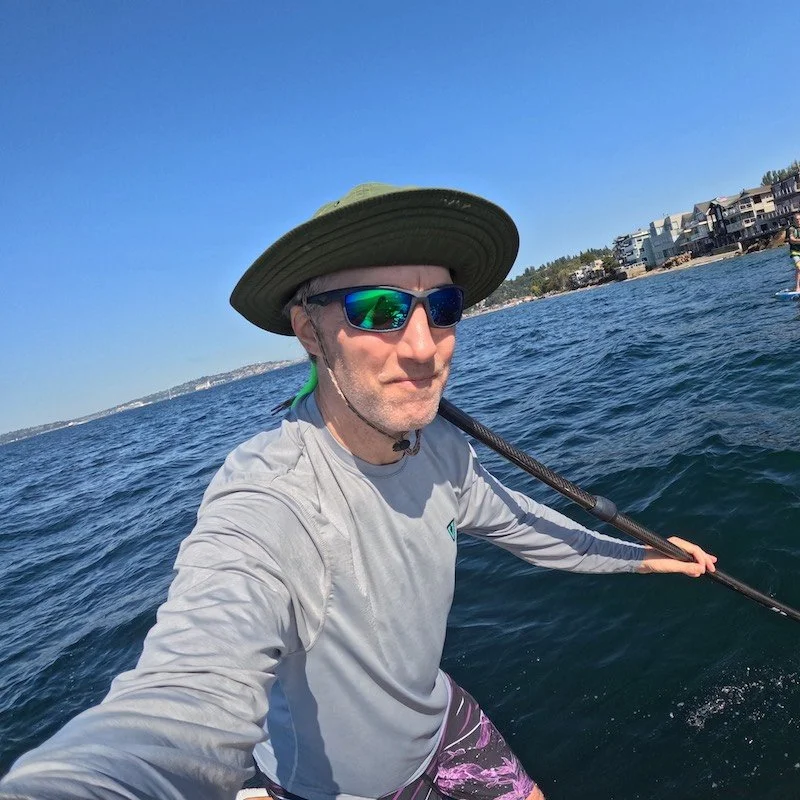 Aaron paddle boarding in Seattle