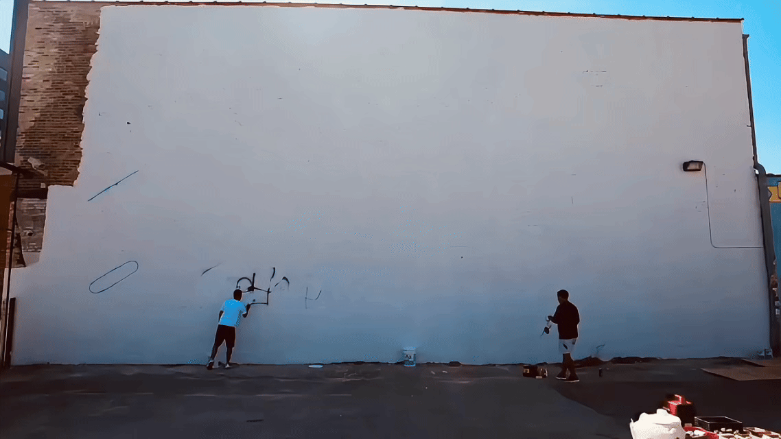 Time-lapse view of the "Art of the Chalice" Stella Artois mural by Mauricio Ramirez in Chicago's Logan Square, showing commercial mural production with exterior painting assistance from DiverCity Artistry.