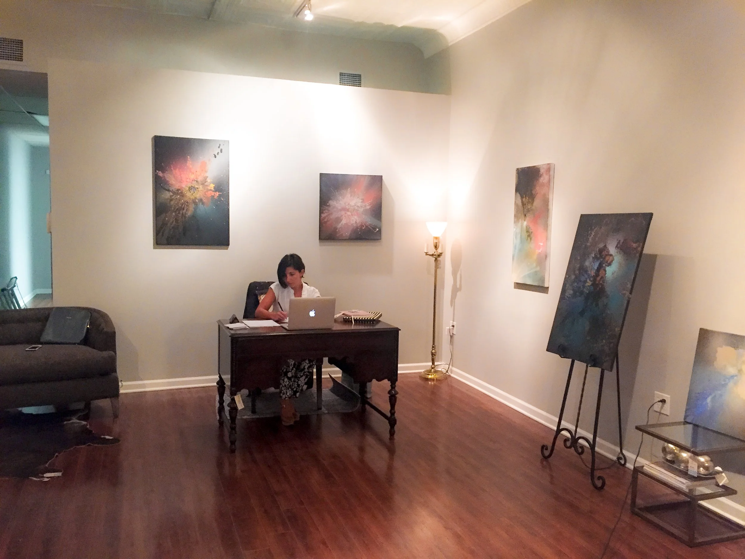 Chicago abstract art exhibition with original paintings displayed inside a polished interior design studio space