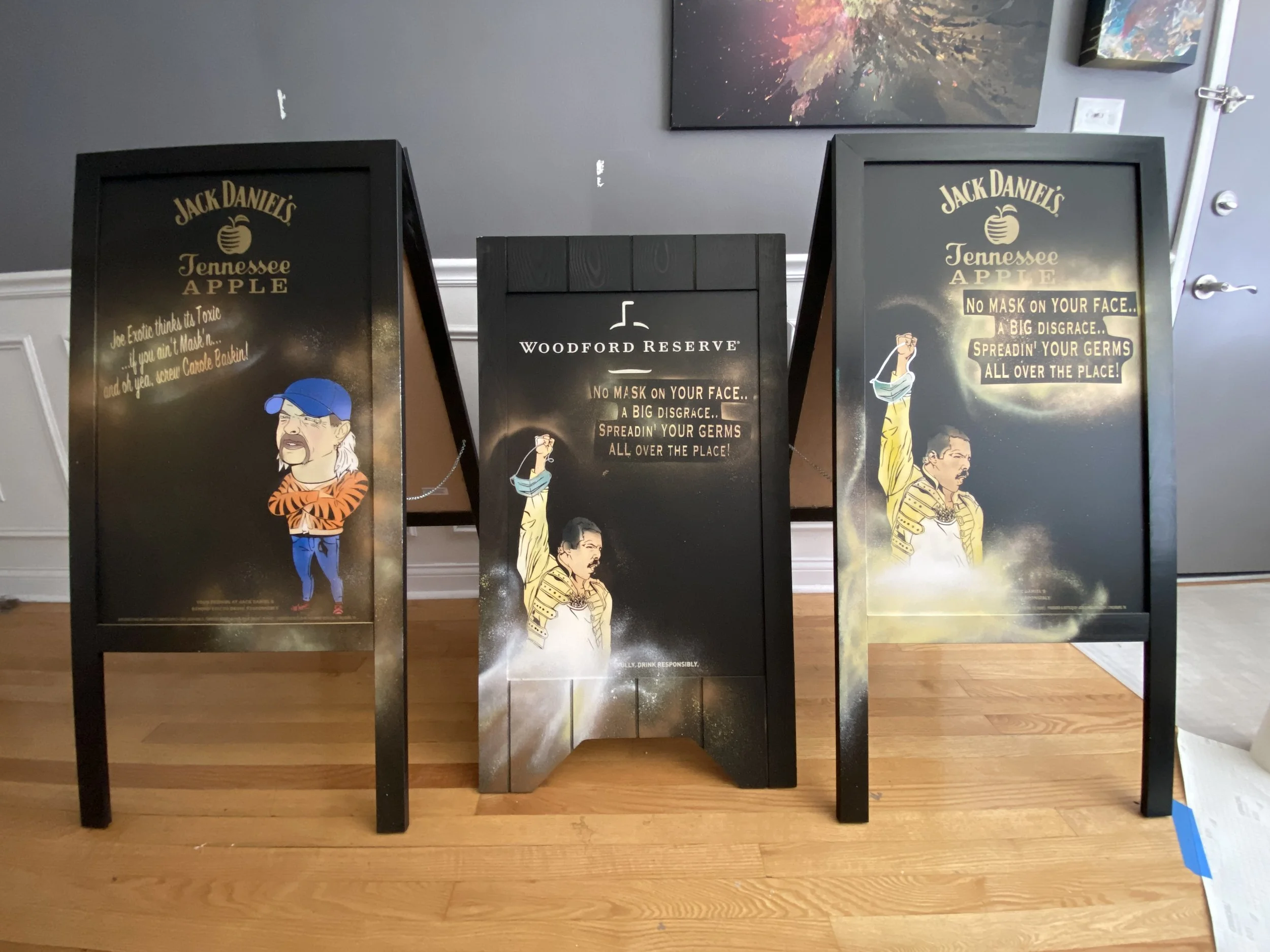 Hand-painted Jack Daniel’s and Woodford Reserve promotional A-frame boards created for Breakthru Beverage Illinois using custom stencils, spray paint, and airbrush detailing.