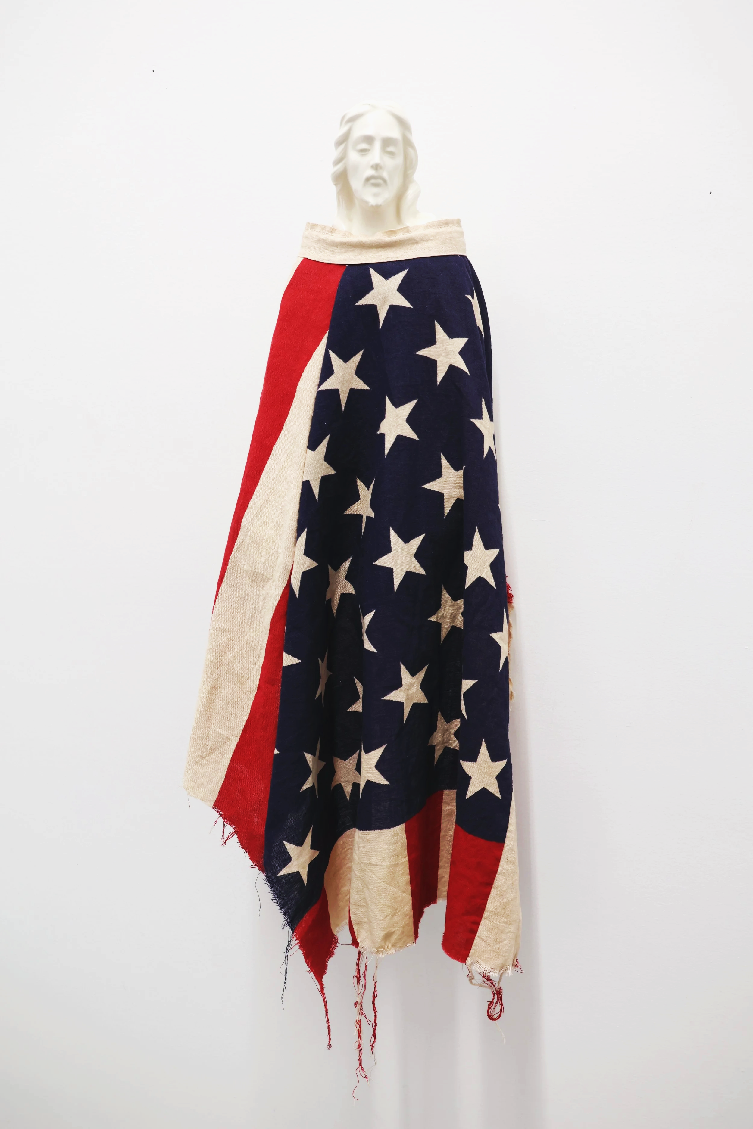 Untitled
2025
porcelain, wood, metal, flag
9" x 27" x 5.5" (22.86 x 68.58 x 13.97 cm)