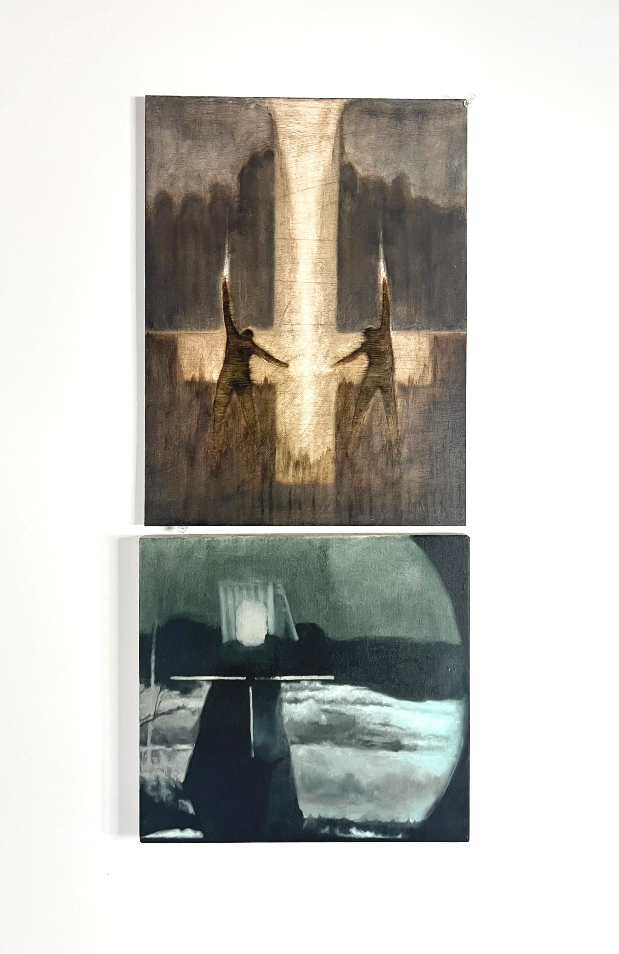 Two paintings on a white wall, the top painting features two soldiers aiming rifles at each other with a large figure in the background, the bottom painting depicts a dark tunnel or underside of a bridge with a vehicle in the distance.