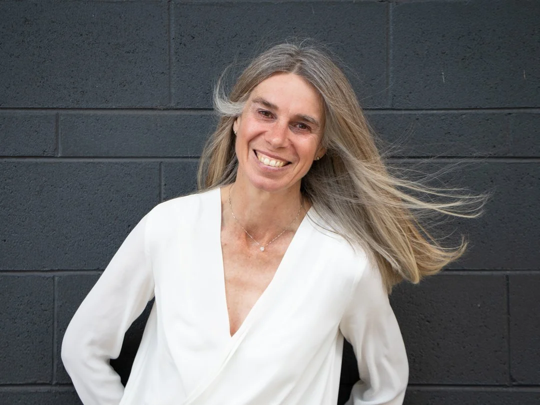 Confidently smiling and welcoming woman