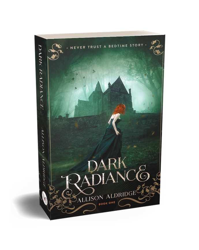 A paperback book titled "Dark Radiance" by Allison Aldridge, labeled as "Book One". The cover features a dark, misty forest with a large, ominous mansion in the background and a woman with red hair in a long black dress walking towards the mansion.