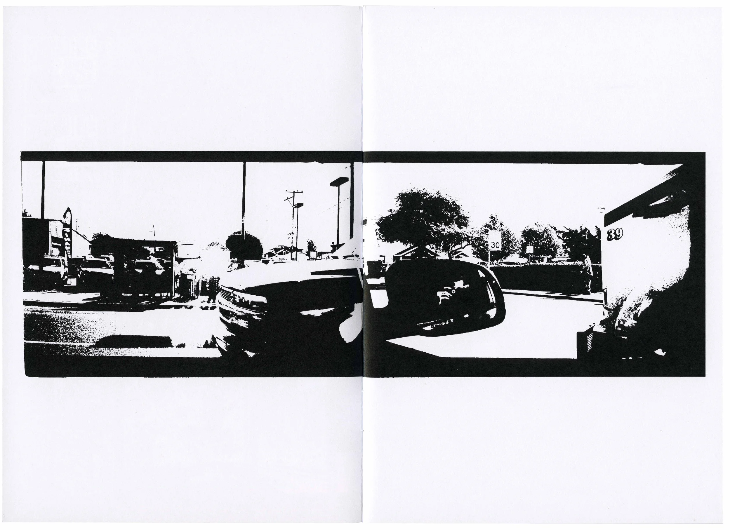Black and white high-contrast photograph of a parking lot with several cars, trees, and utility poles, taken from inside a building with a large window or glass at the front.