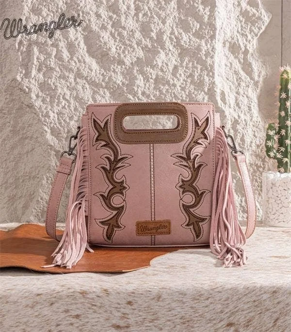 Pink western handbag with fringe and embroidered detailing.