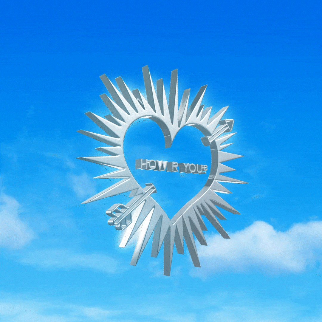 A metallic heart-shaped sculpture with spikes radiating outward and the words 'How R You' inside, set against a blue sky with clouds.
