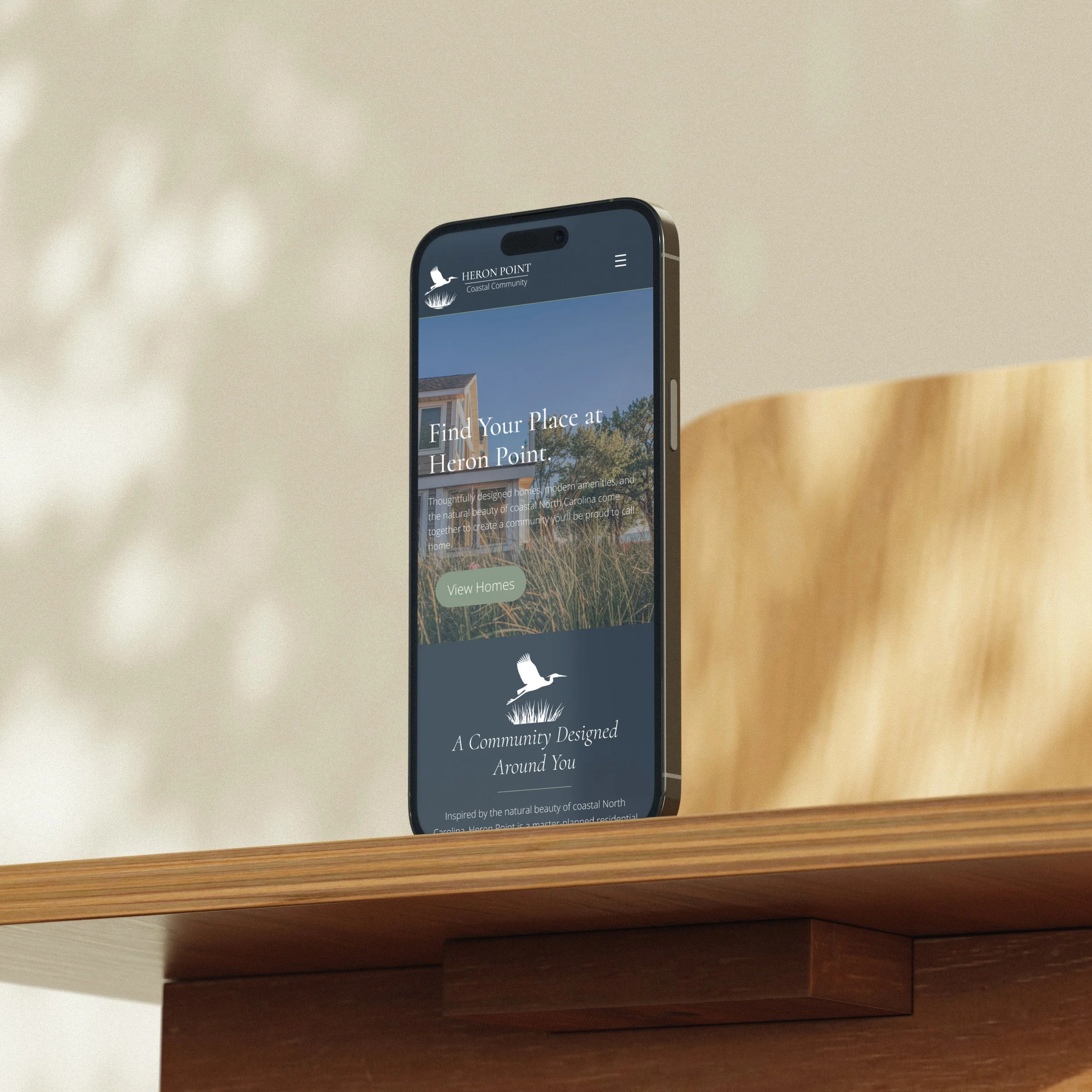 Mockuuups Free iPhone mockup on a wooden desk in sunlight.jpg
