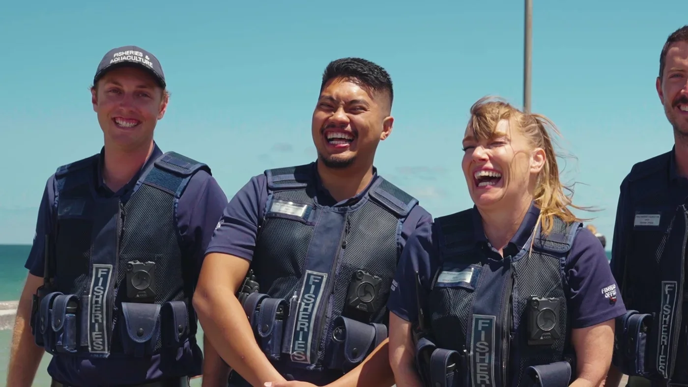 Fisheries officers laughing during recruitment video production