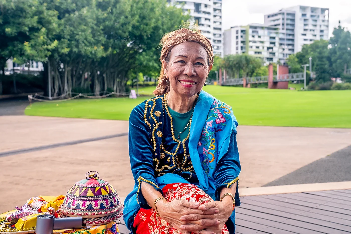 Woman smiling in traditional Filipino clothing during cultural dance event