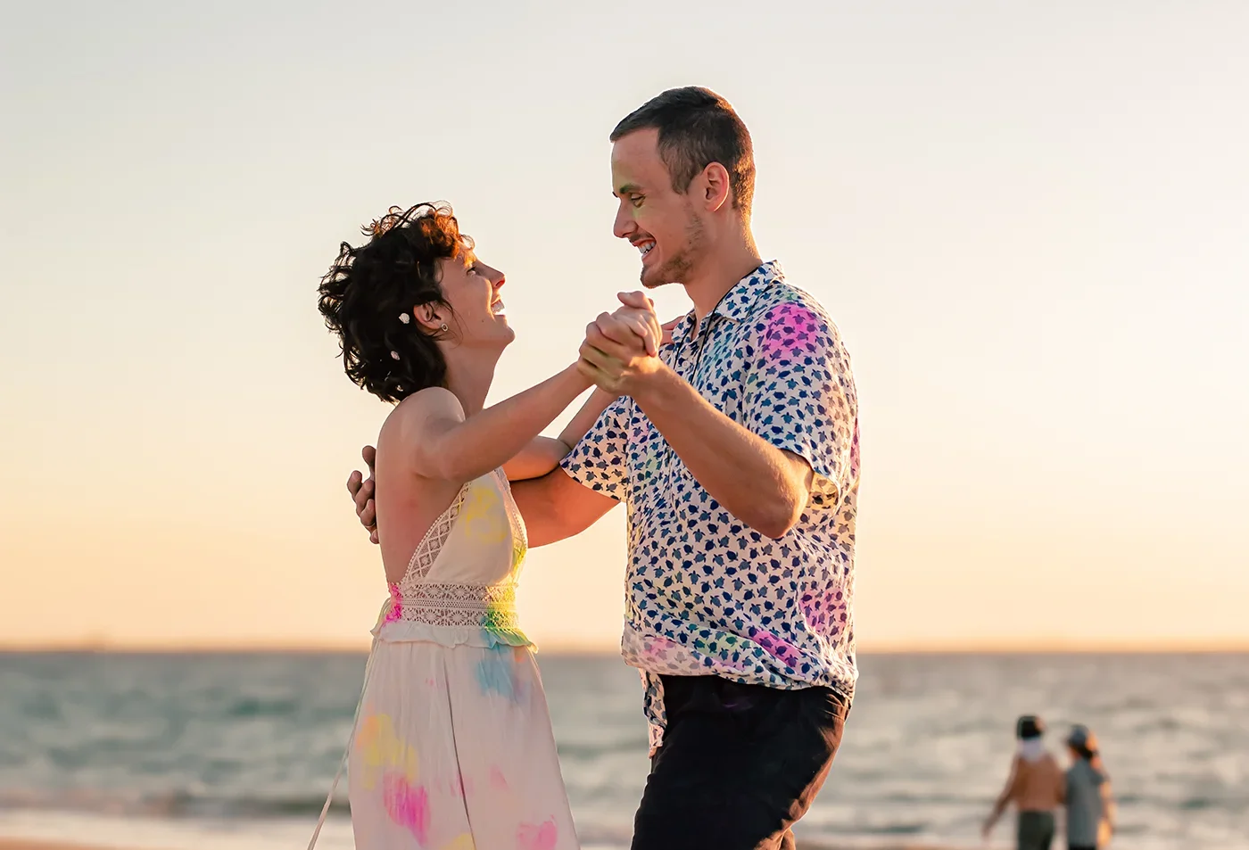 Bride and groom dancing during golden hour wedding photography