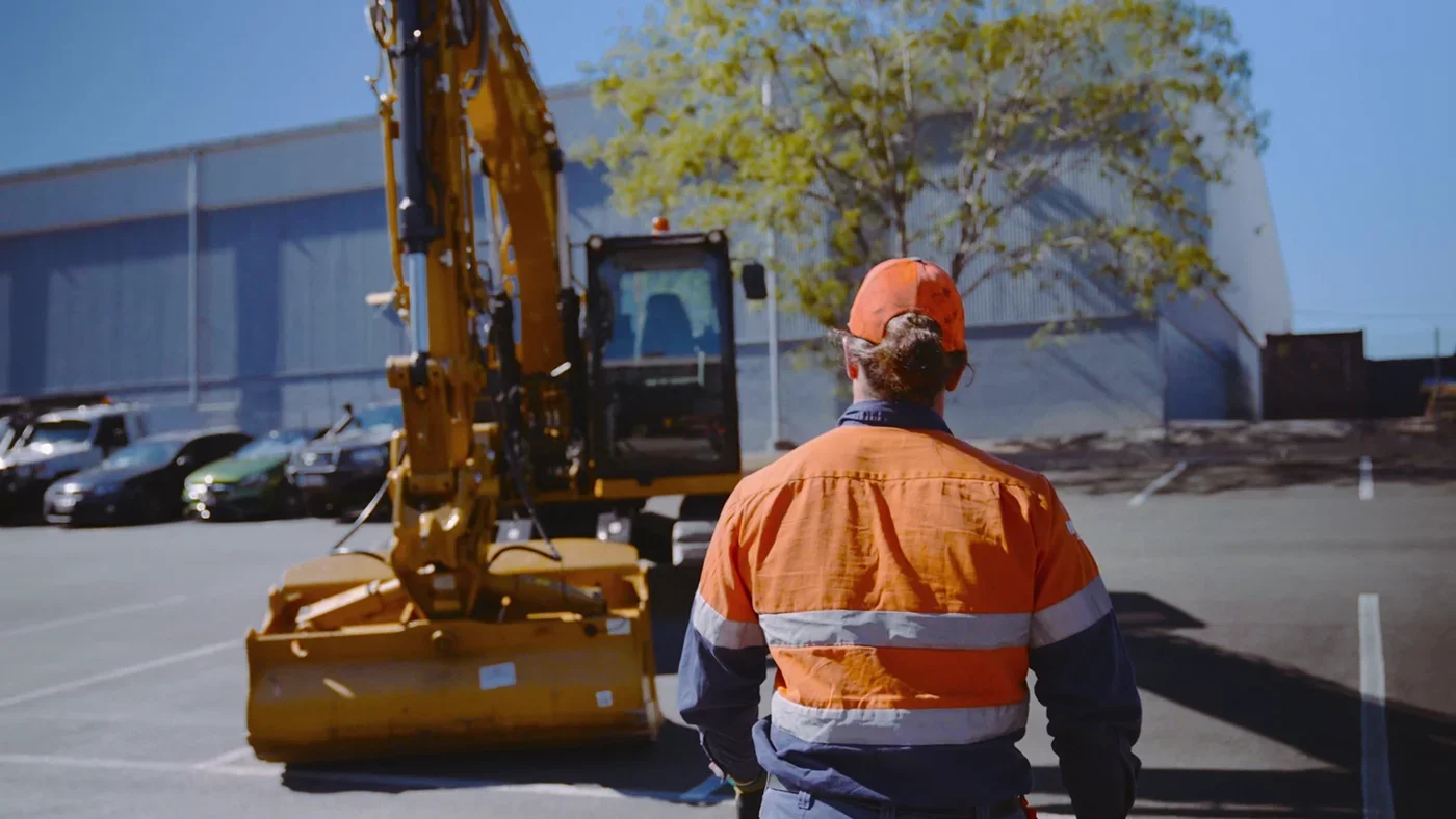 Construction branding videography featuring a CAT machinery operator during a competition introduction video, captured with a natural and professional documentary-style approach.