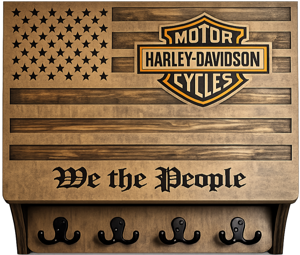 A wooden wall art piece featuring the American flag design with the Harley-Davidson Motor Cycles logo in the center, and the phrase "We the People" written below. It has four black hooks at the bottom for hanging items.