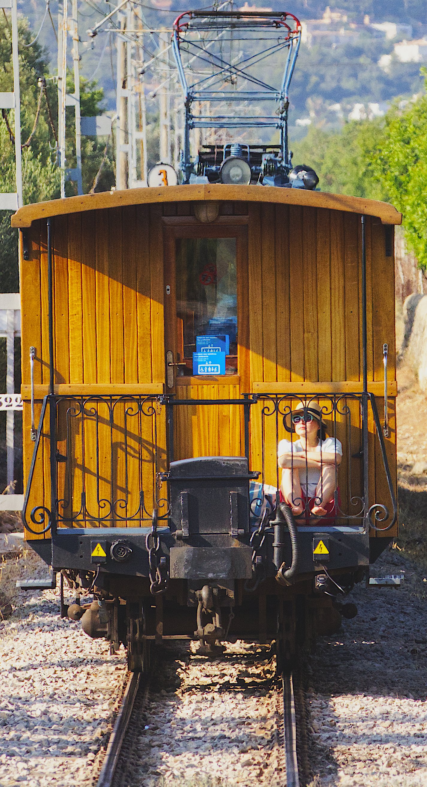 Woman on the back of a tram - IMG_4144.jpg