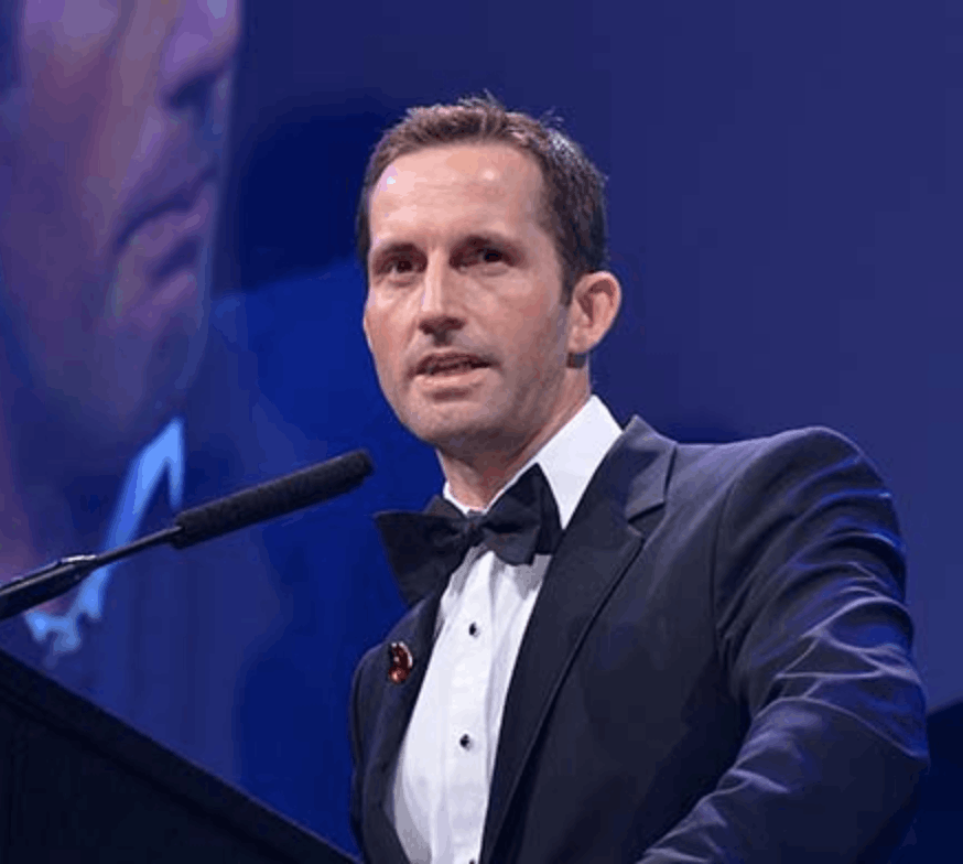 Headshot of Sir Ben Ainslie, high-performance leadership and resilience keynote speaker, represented by 92 Speakers Bureau