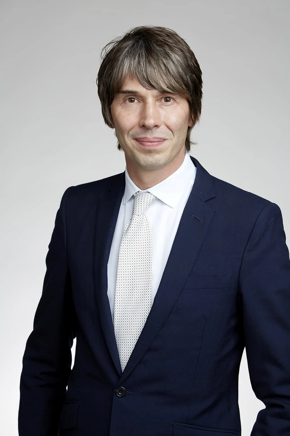 Professor Brian Cox keynote speaker headshot — physicist and science communicator