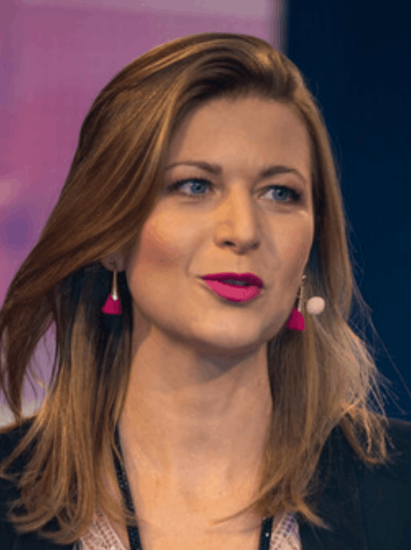 Katharina Moser, IDG Director and experience designer, moderating a 2026 summit on inner development and global sustainability goals.