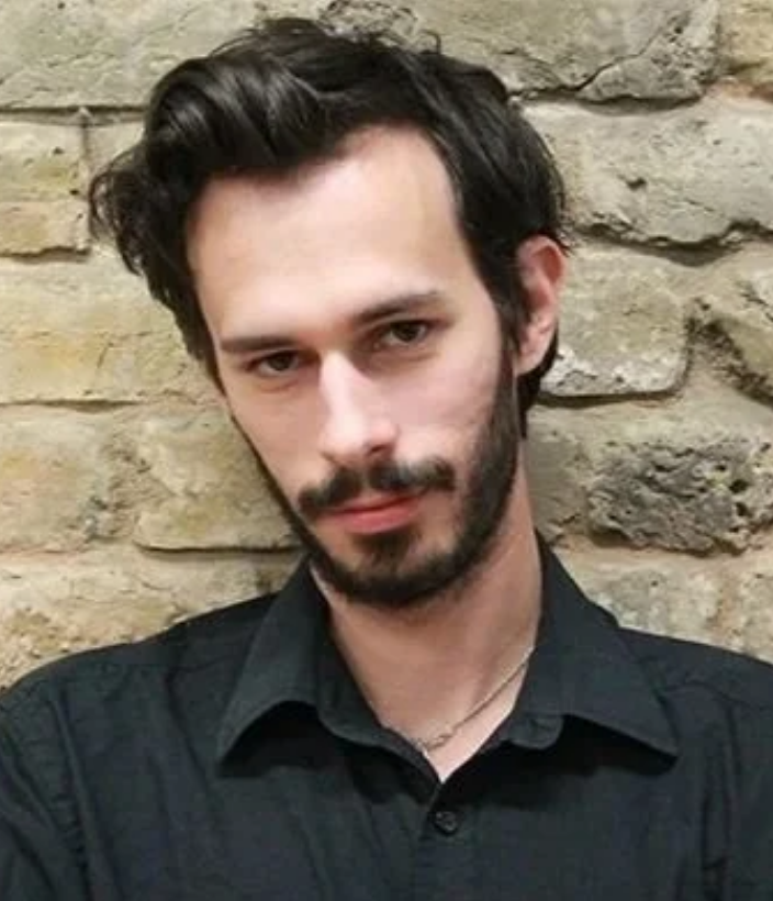 Headshot of Carl Miller, expert on digital power, online harm, and societal risk,