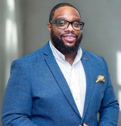 Emmanuel Asuquo headshot, financial expert and broadcaster speaking on confidence, resilience and financial wellbeing