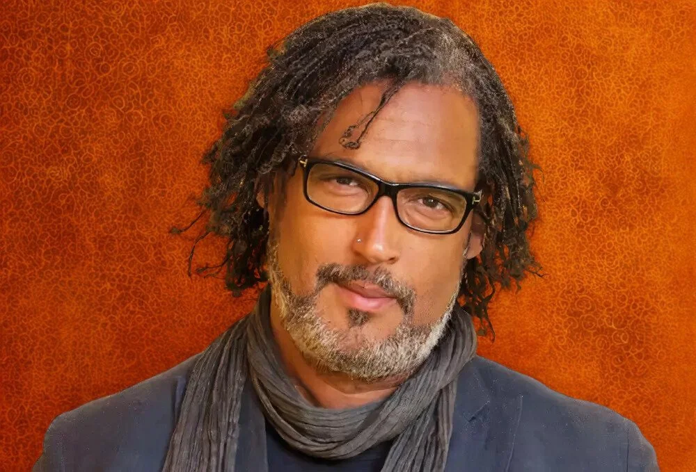 Headshot of David Olusoga, historian and expert on identity, power, and shared history