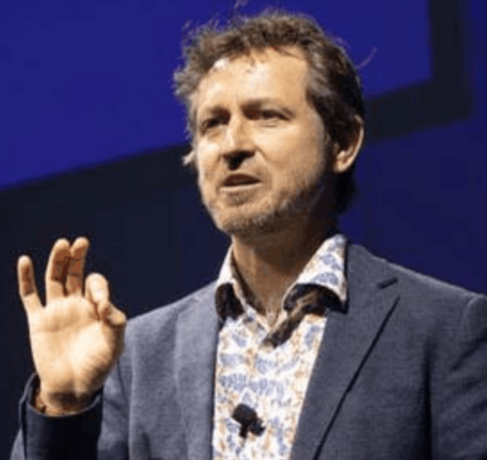 Dr Chadden Hunter, director of 'The Raftsmen' and producer of 'Frozen Planet', on stage for 92 Speakers delivering keynotes on "The Raft Ecosystem" and the 2026 psychology of extreme survival.