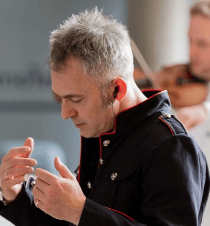 Charles Hazlewood, Artistic Director of Paraorchestra and Sky Arts Ambassador, conducting an ensemble or leading an interactive leadership workshop for business professionals.
